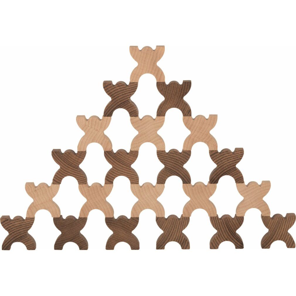Holzfiguren, hell und dunkelbraun, pyramidenförmig gestapelt. Figuren mit X-Form, für ein Balance-Spiel.