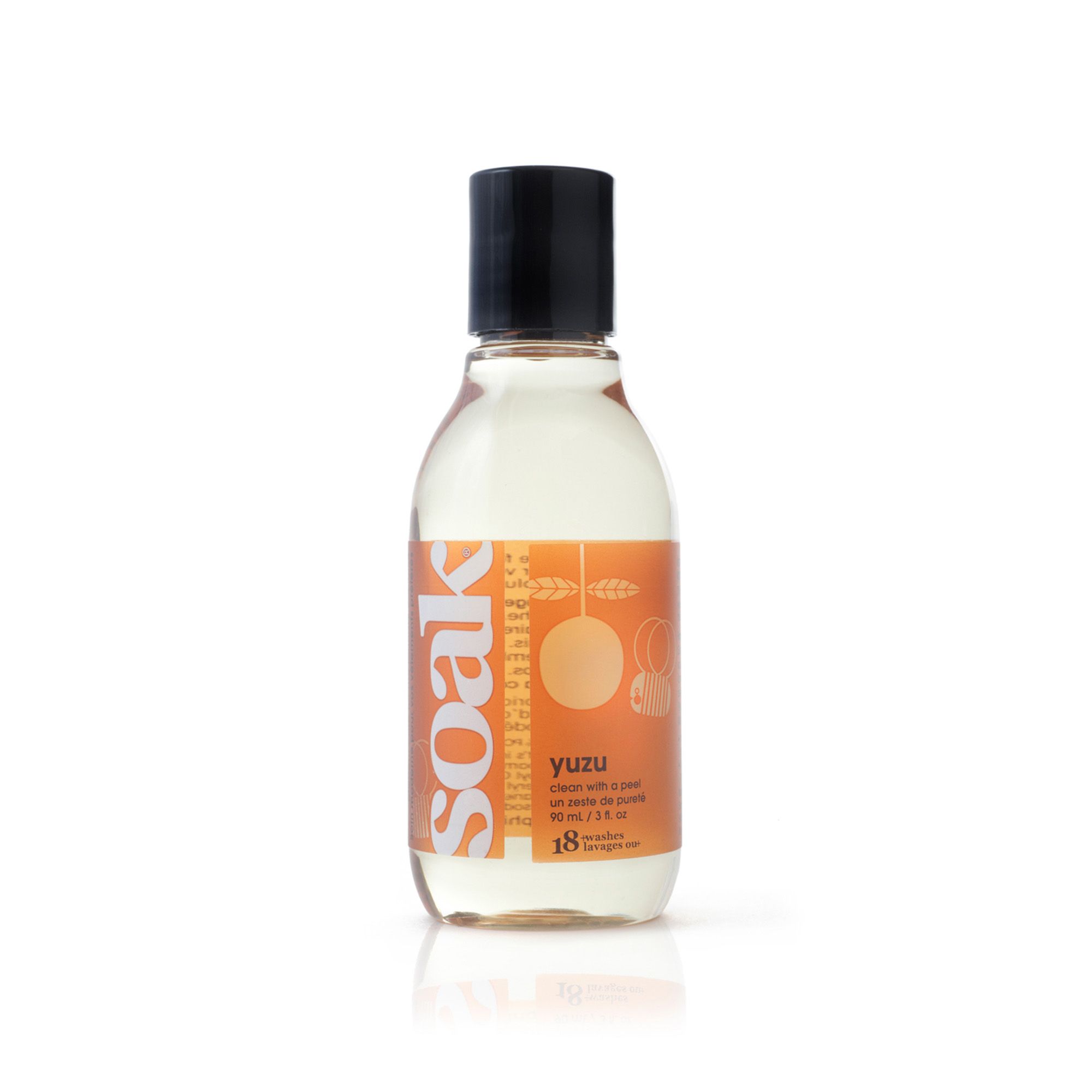 Klare Flüssigkeit in einer Flasche mit schwarzem Deckel. Auf dem Etikett steht "soak" und "Yuzu".