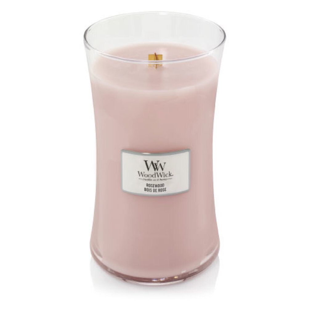 Kerze in Glasbehälter. Rosa Wachs, Holzdocht. Silbernes Etikett mit Logo und Text.