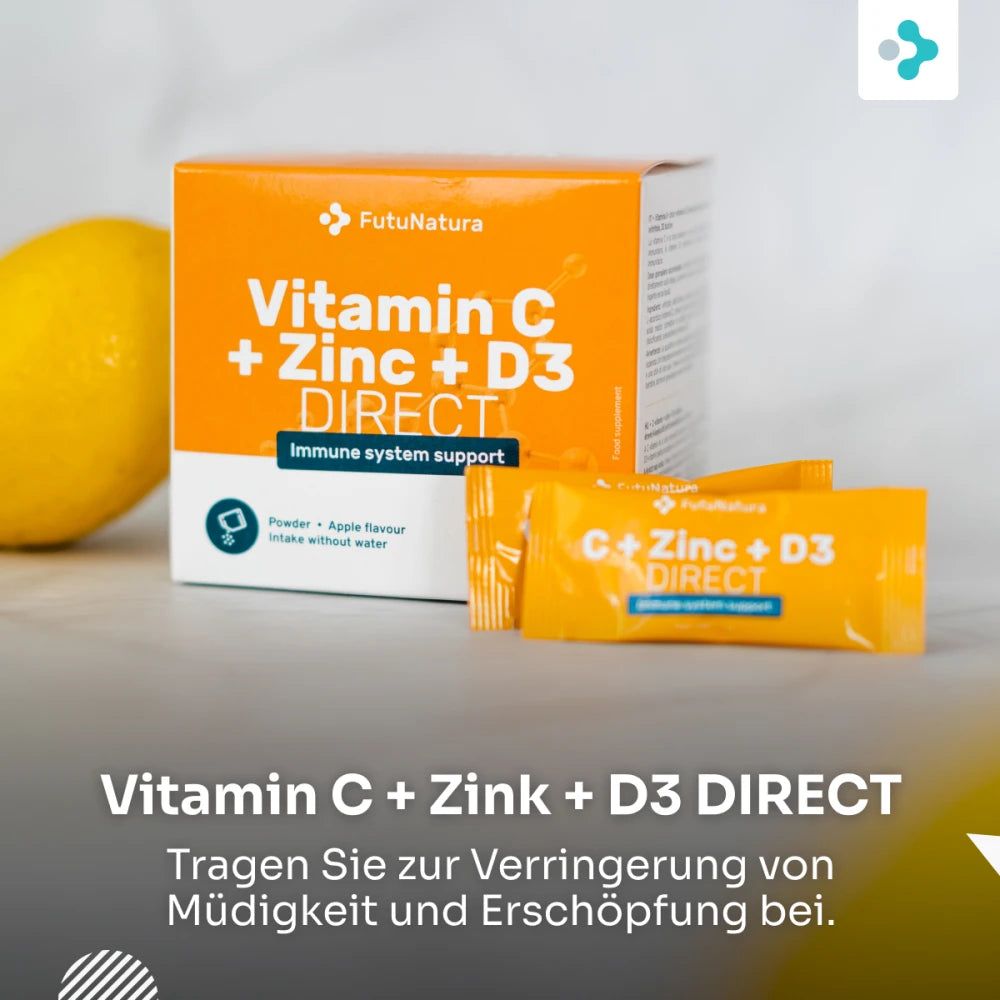 Orangefarbene Schachtel und Beutel mit der Aufschrift "Vitamin C + Zink + D3 DIRECT". Daneben eine Zitrone.