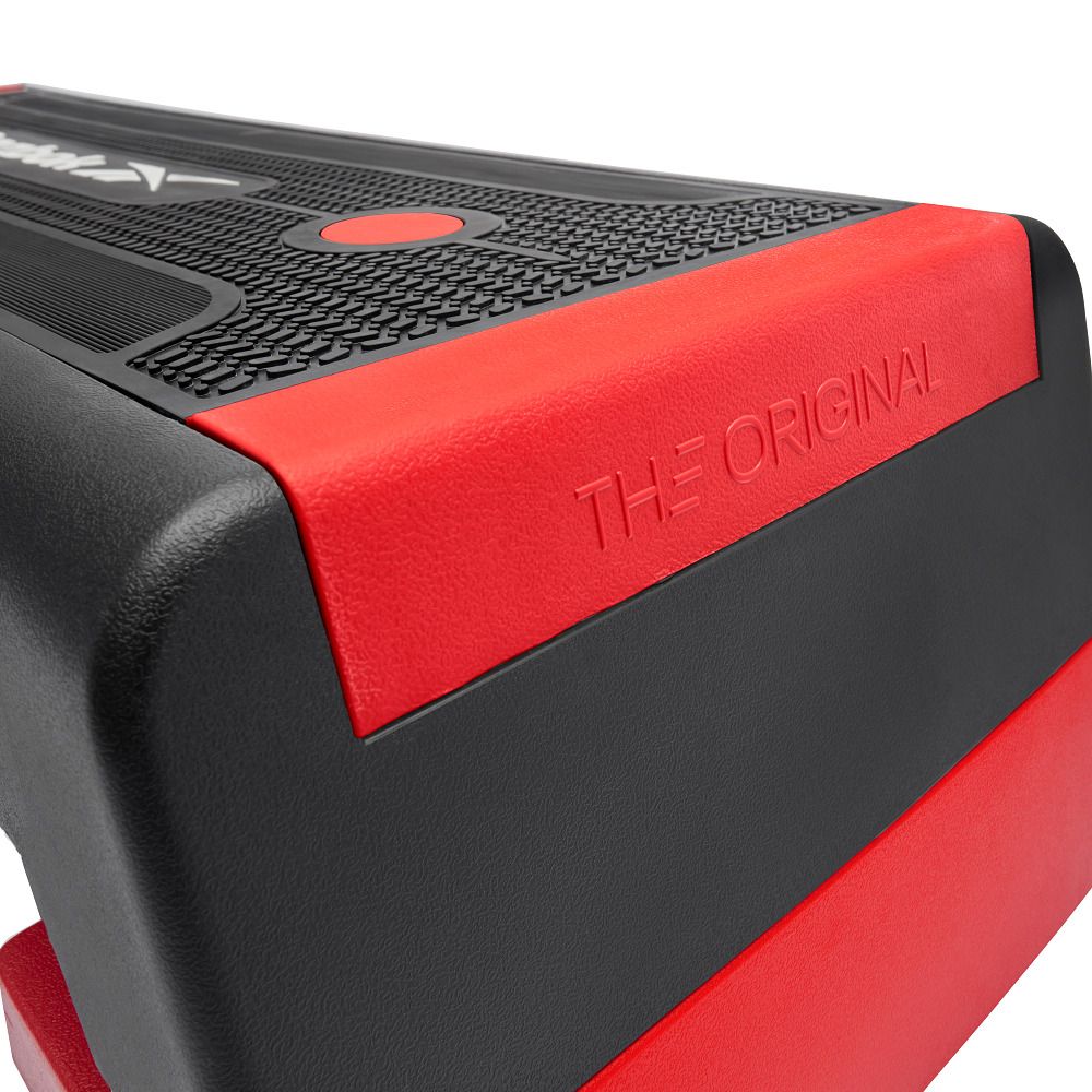 Reebok Aerobic-Stepper, schwarz mit roter Kante. Aufschrift 'THE ORIGINAL' auf roter Fläche.