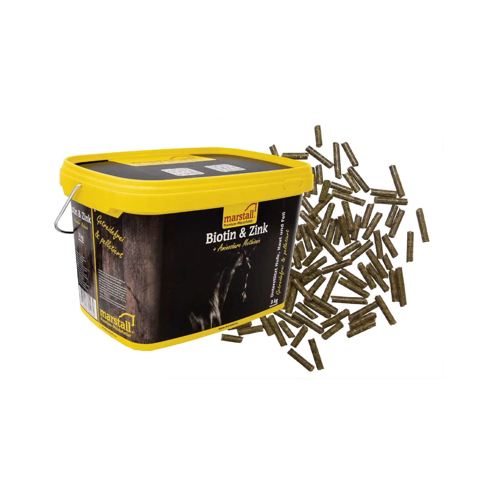 Marstall Biotin & Zink Pellets in einem gelben Eimer mit schwarzem Etikett, daneben verstreute Pellets.