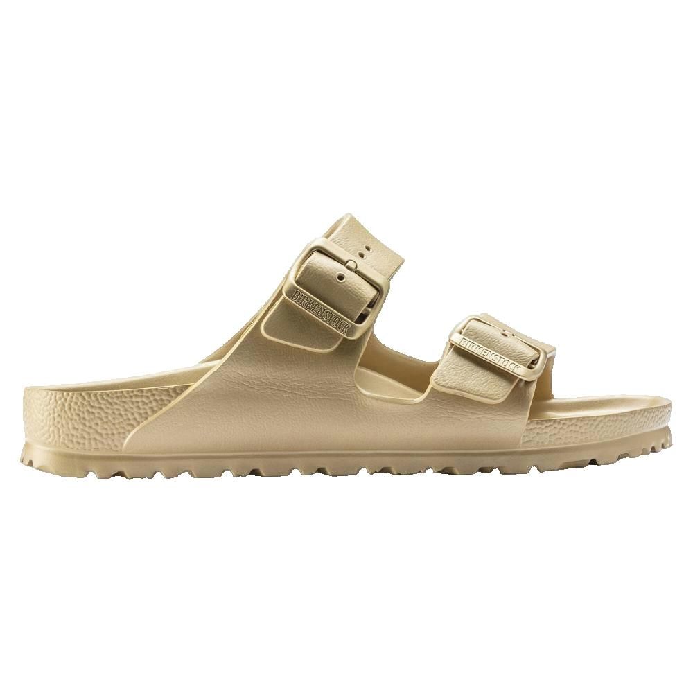 Sandali beige con due cinturini e fibbie. Suola sagomata. Marchio sulle fibbie.