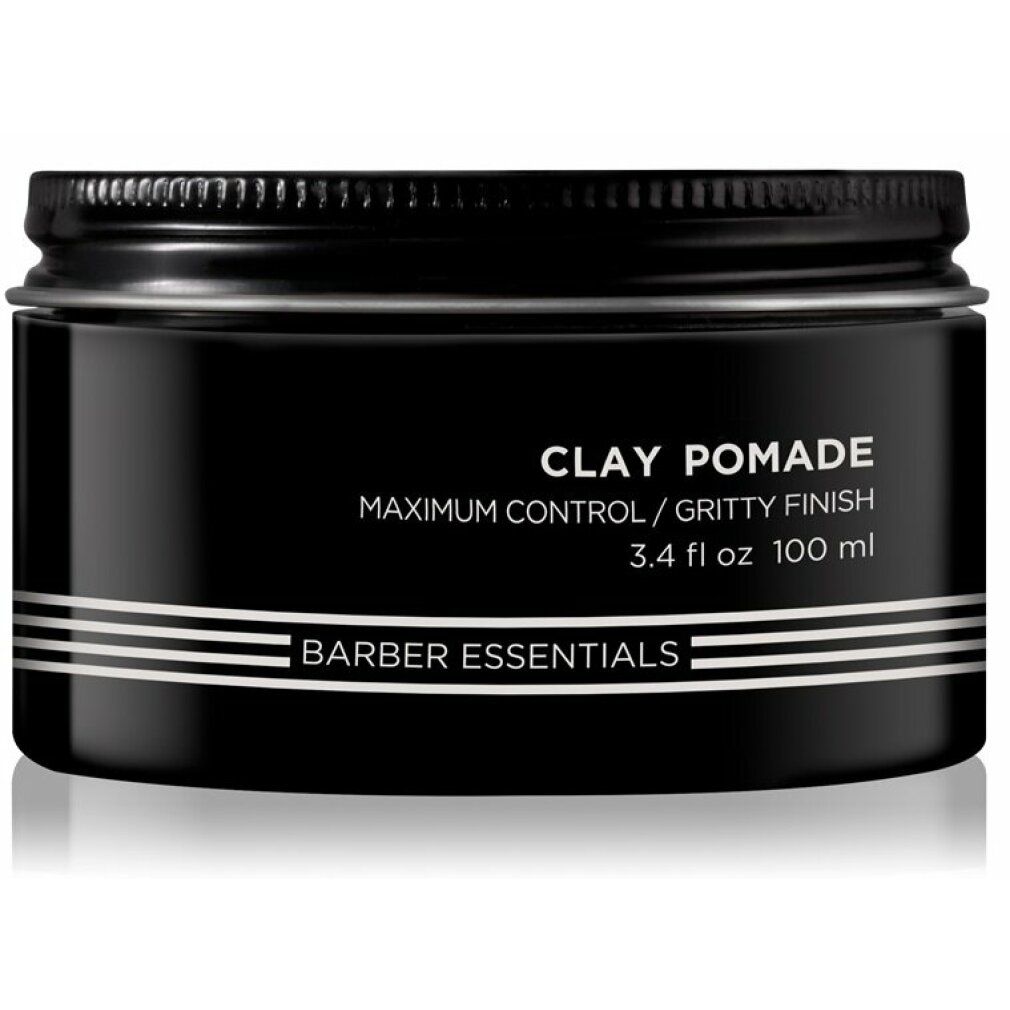 Schwarze Dose mit Deckel. Aufschrift: Clay Pomade, Barber Essentials. 3.4 fl oz 100 ml.