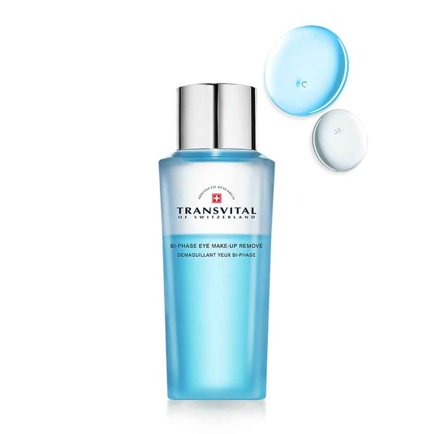 Transvital Bi-Phase Augen-Make-up Entferner. Flasche mit silbernem Deckel. Blaue Flüssigkeit. Zwei Tropfen daneben.