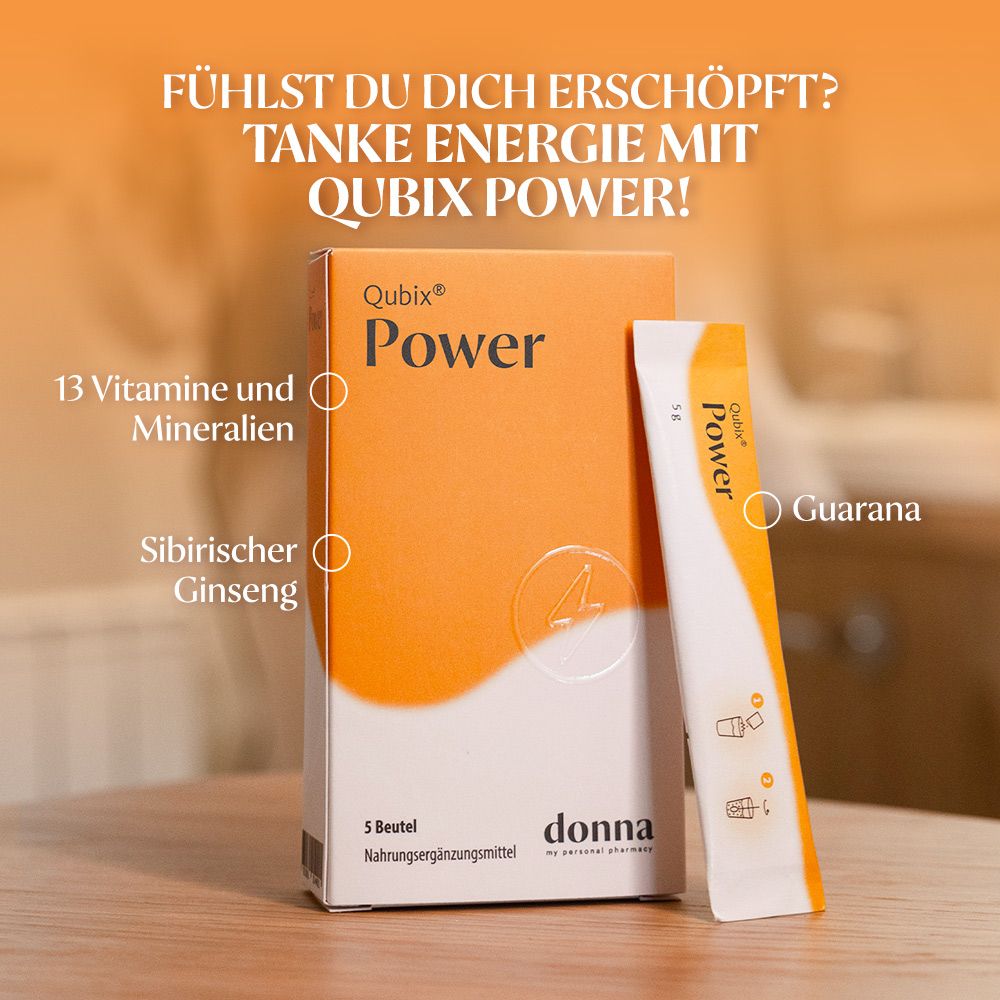 Qubix Power-Schachtel und Beutel. Schachtel orange mit weißer Schrift. Beutel weiß-gelb. Aufschrift Power.