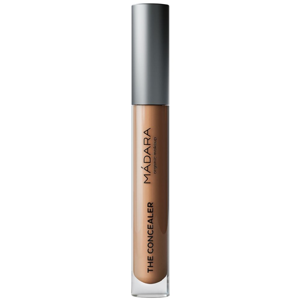 Konzentrat in länglicher, transparenter Flasche mit silbernem Deckel. Aufschrift: MÁDARA, THE CONCEALER.