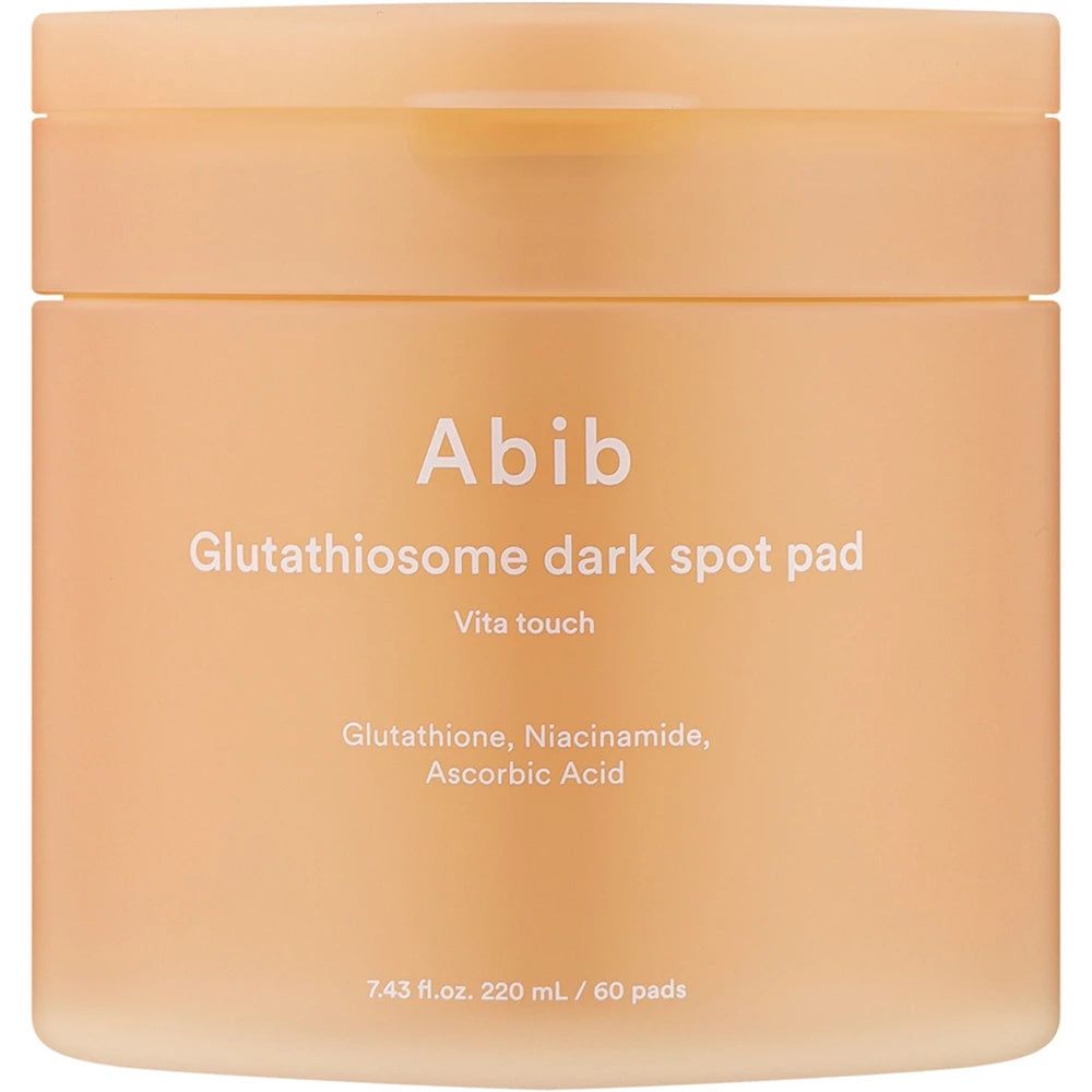 Beige Dose mit Deckel. Aufschrift: Abib Glutathiosome dark spot pad. Text: Vita touch. Inhaltsstoffe: Glutathion, Niacinamid, Ascorbinsäure.