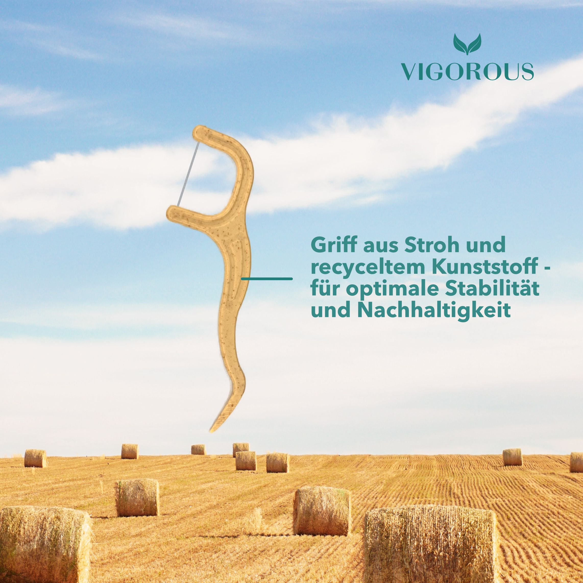 Zahnseide-Stick vor Feld. Aufschrift: VIGOROUS, Griff aus Stroh und recyceltem Kunststoff - für optimale Stabilität und Nachhaltigkeit.