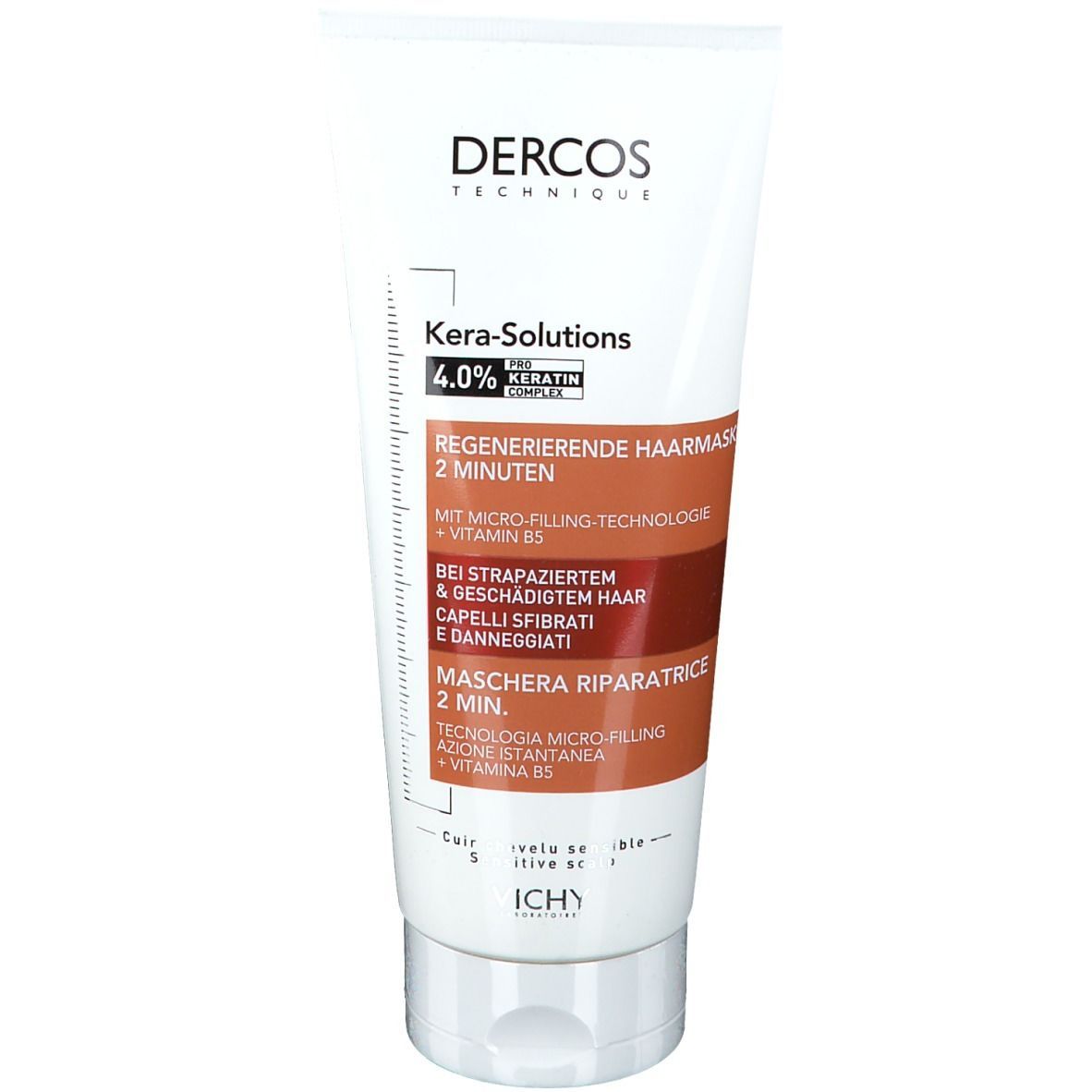 Weiße Tube mit braunen und schwarzen Texten. "DERCOS" und "Kera-Solutions" sind sichtbar. Enthält 4,0% Keratin Complex.