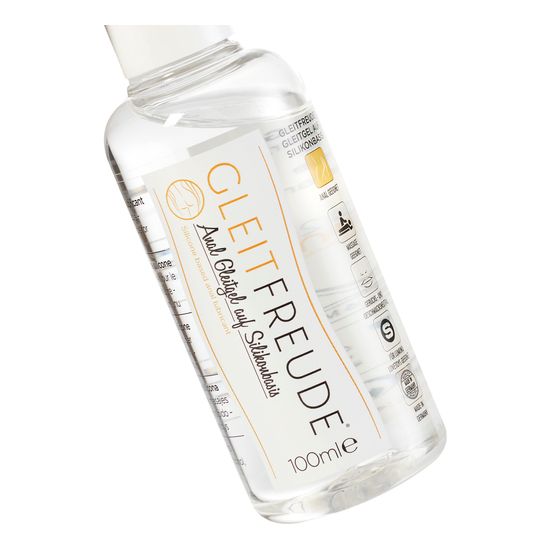 Transparente Flasche mit weißem Deckel. Aufschrift: GLEITFREUDE, Anal Gleitgel auf Silikonbasis. 100ml.