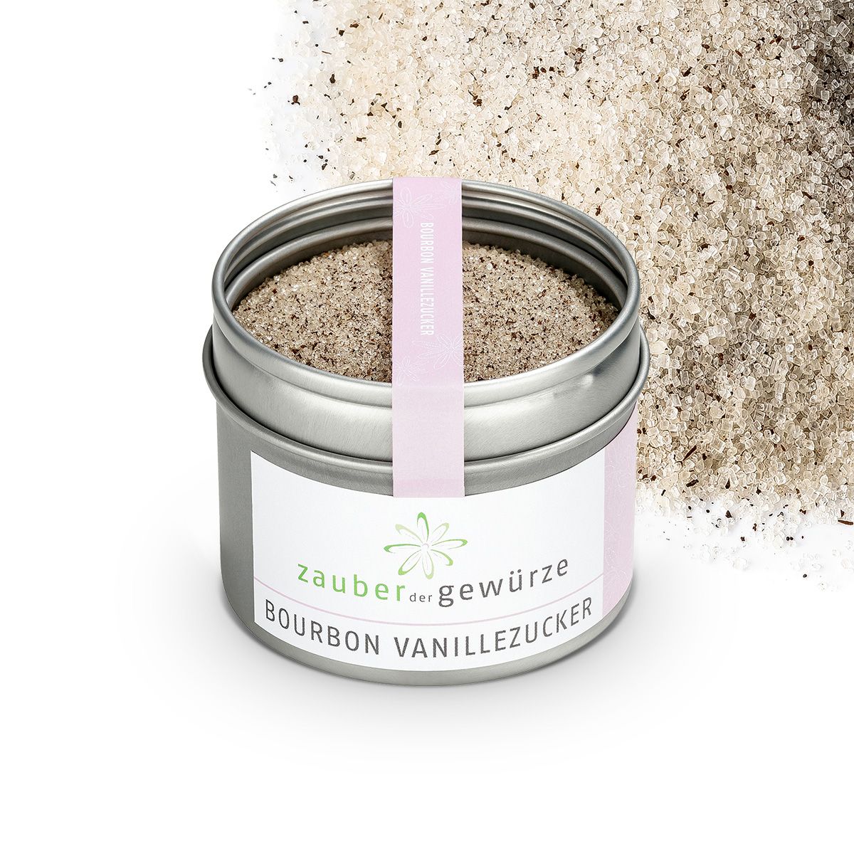 Geöffnete Dose Bourbon Vanille Zucker. Rosa Etikett und Band mit Produktnamen. Zuckerstreusel im Hintergrund.