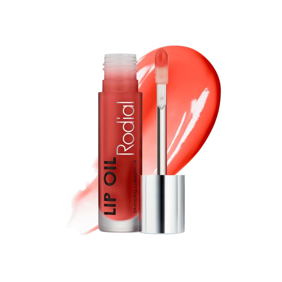 Lippenöl-Flakon mit Applikator. Aufschrift: LIP OIL, Rodial. Korallenfarbene Flüssigkeit. Hintergrund: Lippenöl-Abstrich.
