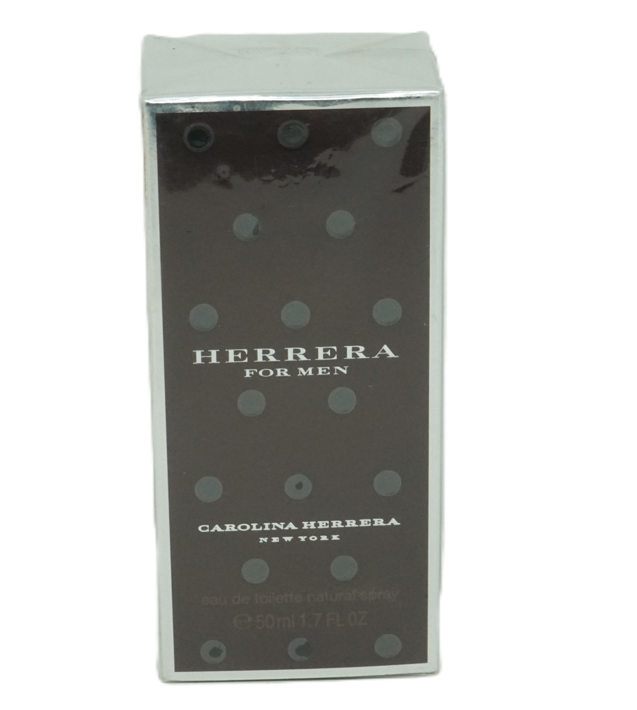 Kartonverpackung mit Punkten und Text. Aufschrift: Herrera For Men, Carolina Herrera New York. Eau de toilette 50ml.