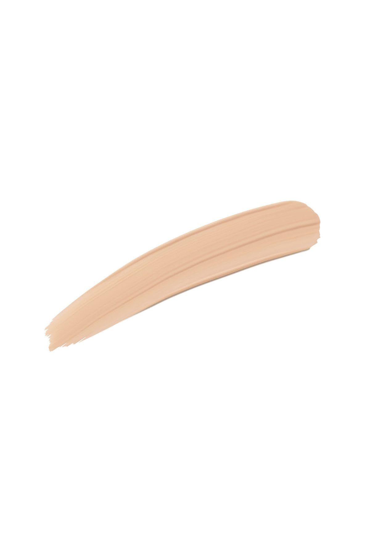 Heller, cremefarbener Farbstrich auf weißem Hintergrund. Textur sichtbar.