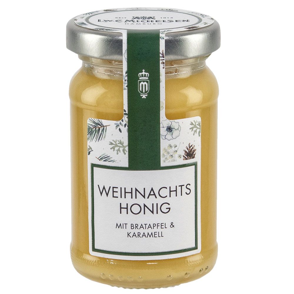 Glas Honig mit Etikett. Aufschrift: Weihnachts Honig mit Bratapfel & Karamell. Deckel mit Logo.