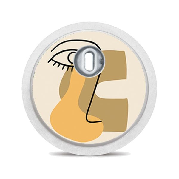 Runder Aufkleber mit abstraktem Gesicht in Beige und Orange. Mit silbernem Mittelteil.