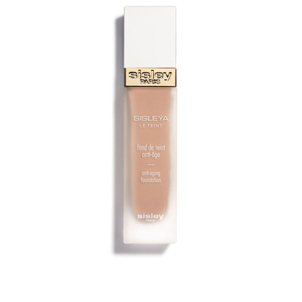 Sisley Sisleya Le Teint Foundation. Rechteckige Flasche mit weißem Deckel. Goldener Schriftzug Sisley Paris.