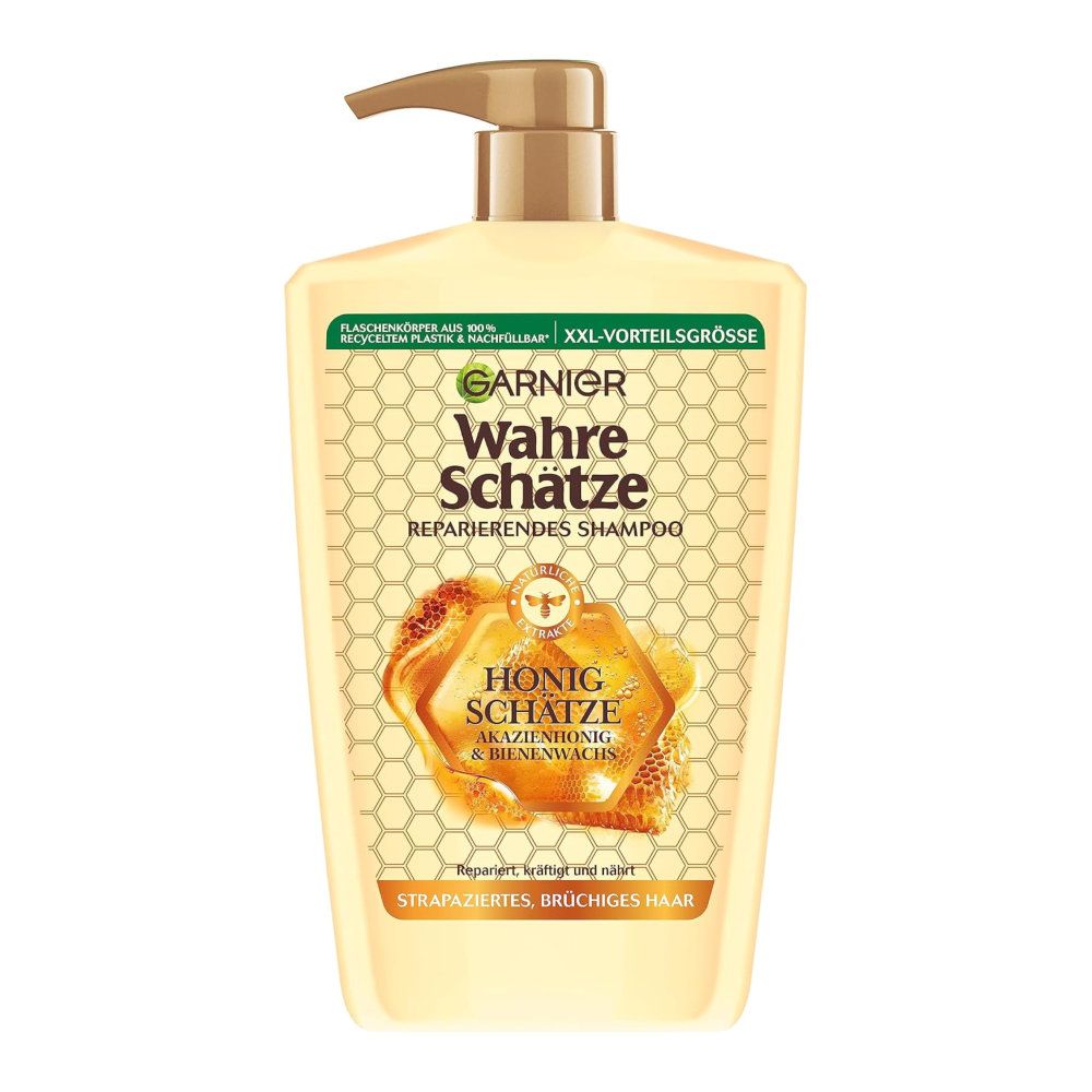 Garnier Wahre Schätze Shampoo Honig. Flasche mit Dosierpumpe. Aufschrift: Reparierendes Shampoo, Honig Schätze, Akazienhonig & Bienenwachs.