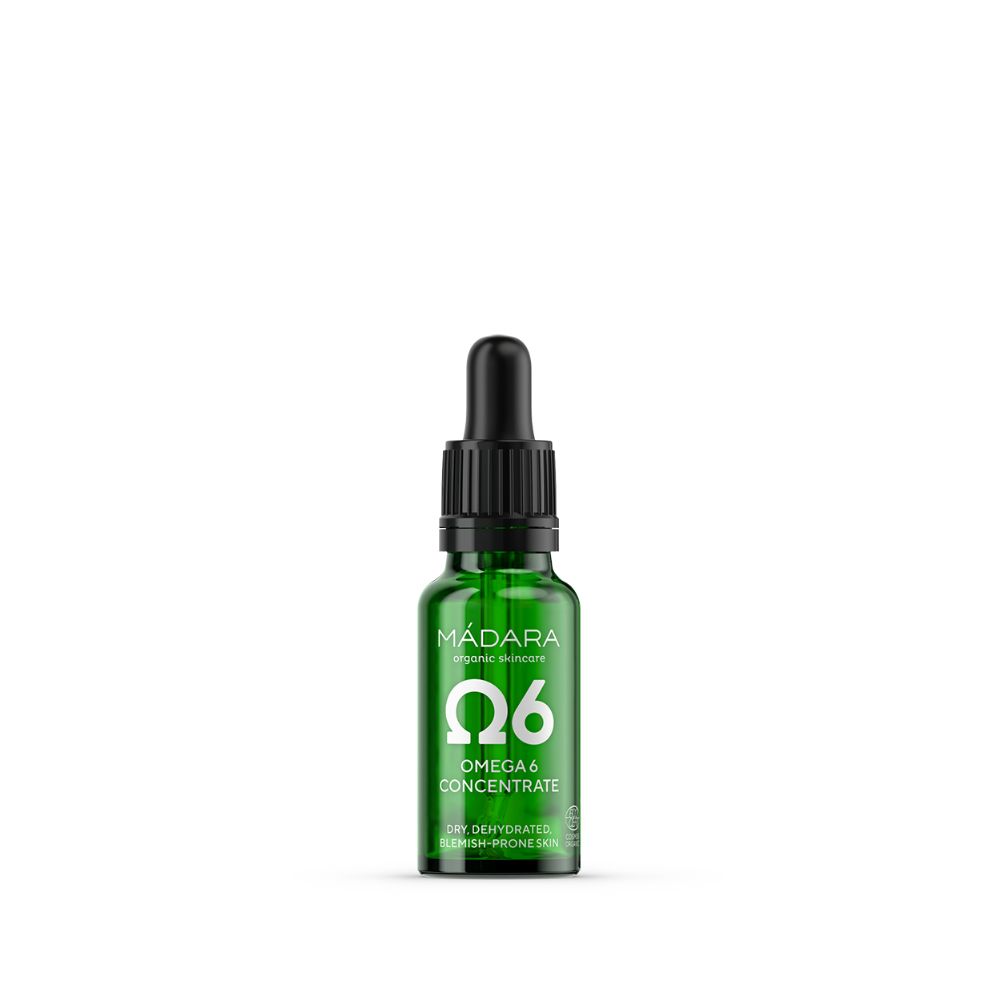 Grüne Glasflasche mit schwarzem Tropfer. Aufschrift: MÁDARA, Omega 6 Concentrate. Für trockene, zu Unreinheiten neigende Haut.