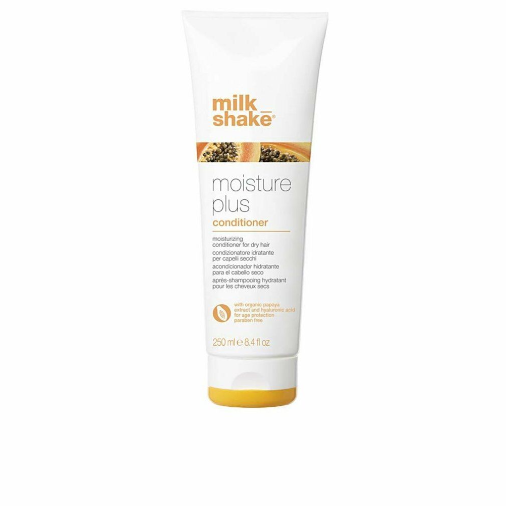 Weiße Tube mit orangefarbenem Deckel. Aufschrift: milk_shake moisture plus conditioner. Text in mehreren Sprachen.