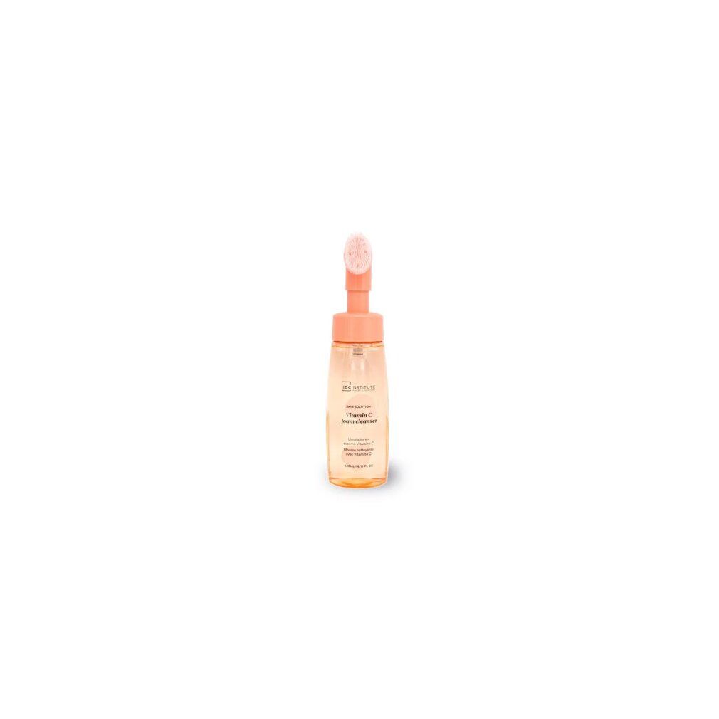 Flüssigreiniger mit Bürstenaufsatz. Transparente Flasche mit orangefarbenem Pumpkopf. Aufschrift nicht lesbar.