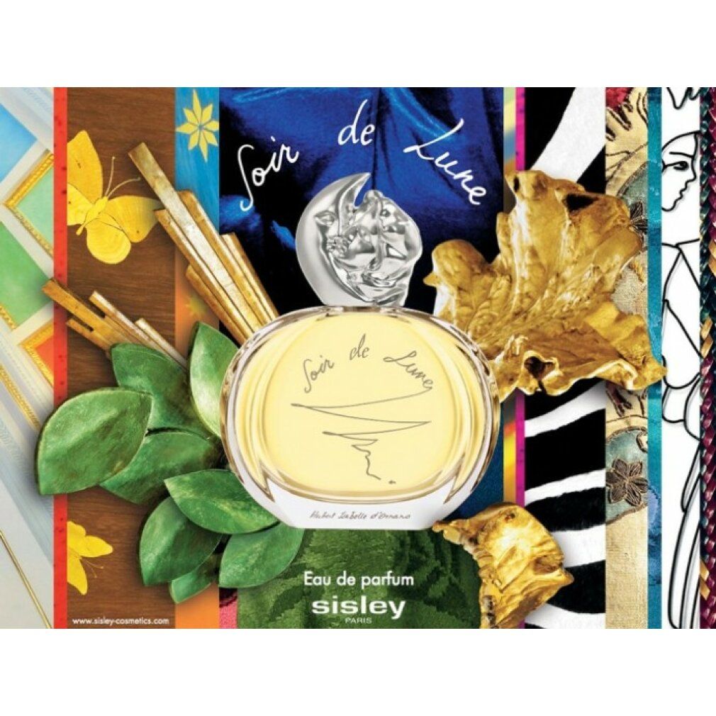 Glasflakon mit Mondverschluss, umgeben von Blättern, Holz, und Stoffen. Aufschrift "Soir de Lune".