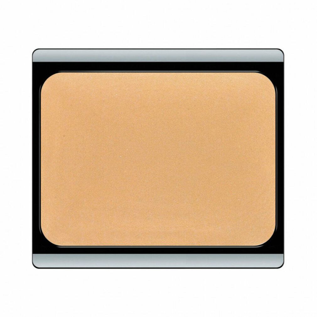 Beige-apricot Camouflage Cream in schwarzem Behälter. Rechteckige Form mit abgerundeten Ecken. Produktansicht von oben.