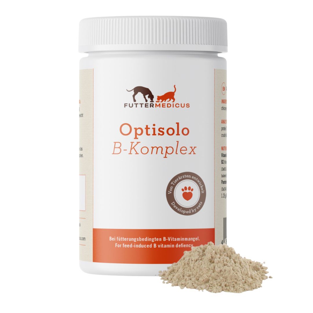 Weiße Dose mit Schraubverschluss. Aufschrift: Futtermedicus Optisolo B-Komplex. Daneben ein Haufen braunes Pulver.