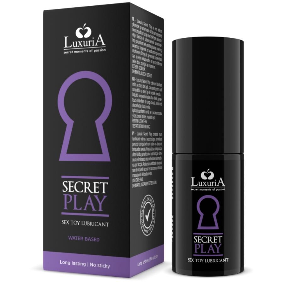 Schwarze Flasche und Schachtel mit Logo und Text. Aufschrift: Secret Play, Sex Toy Lubricant, Wasserbasis. Dermatologisch getestet.