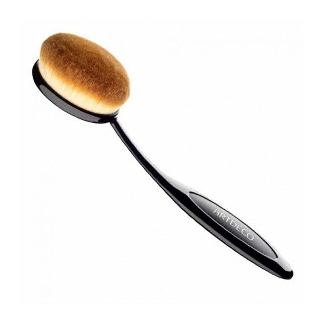 Ovale Gesichtsbürste mit schwarzem Griff. Borsten hellbraun. Griff mit ARTDECO-Schriftzug.