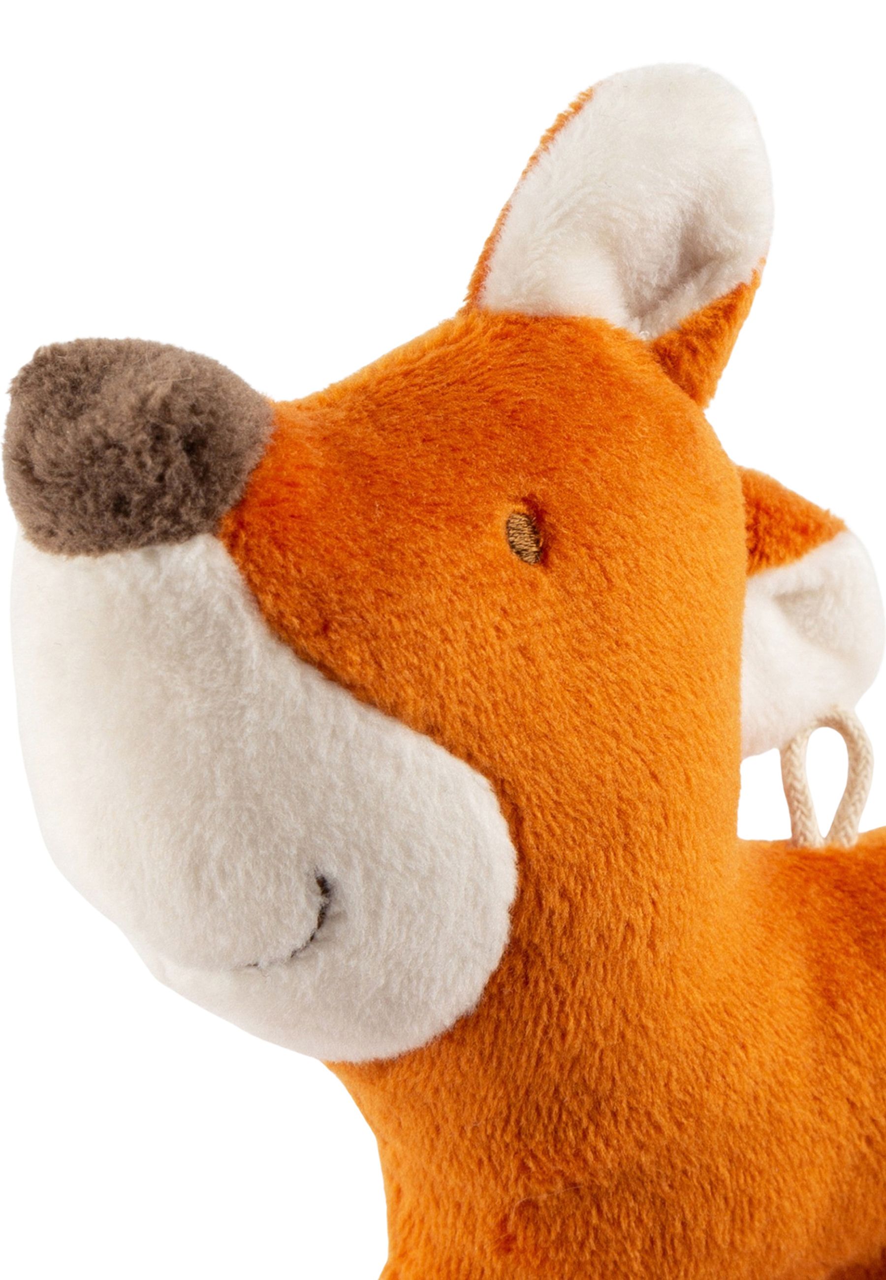 Nahaufnahme eines orangefarbenen Stofffuchses. Weißes Gesicht, braune Nase, Aufhängeschlaufe. Detailansicht.
