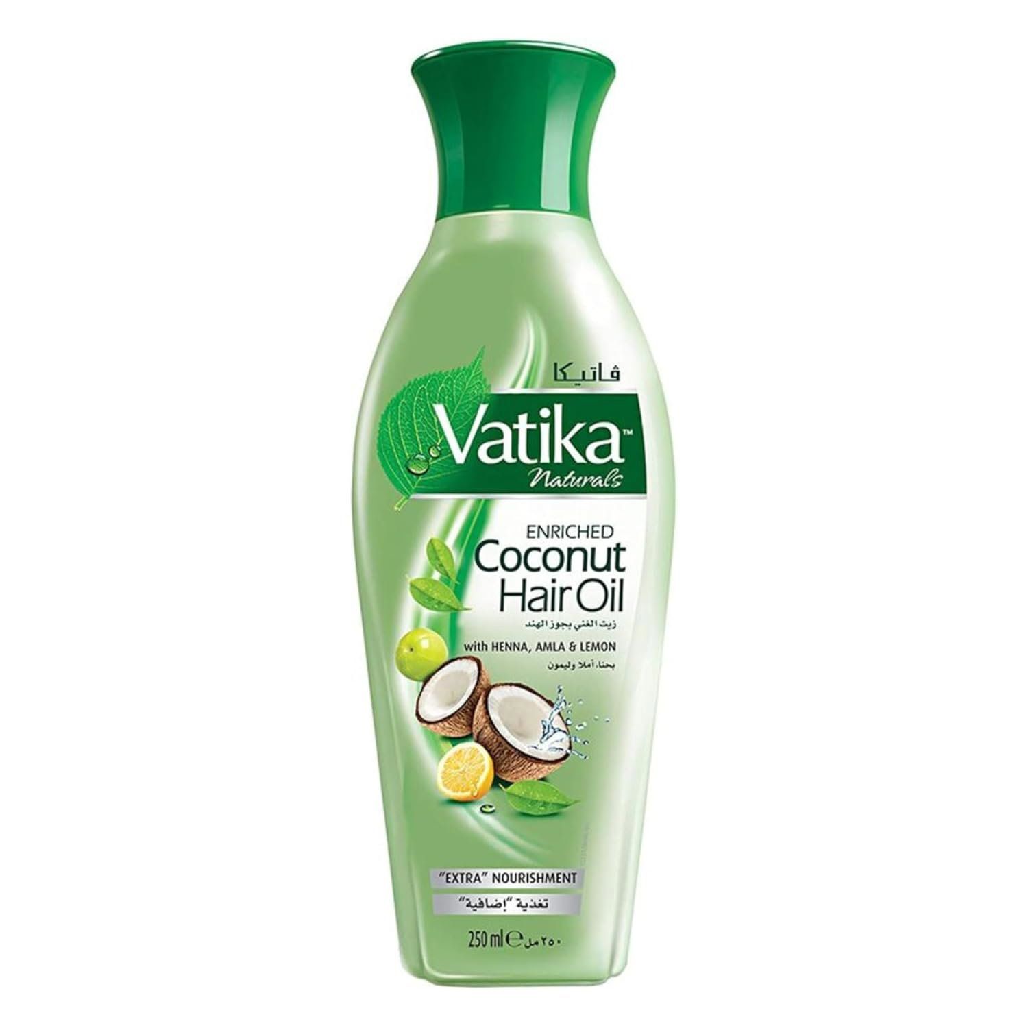 Grüne Flasche Vatika Naturals Kokos-Haaröl. Enthält Henna, Amla und Zitrone. Produktabbildung mit Kokosnuss, Zitrone und Blättern.