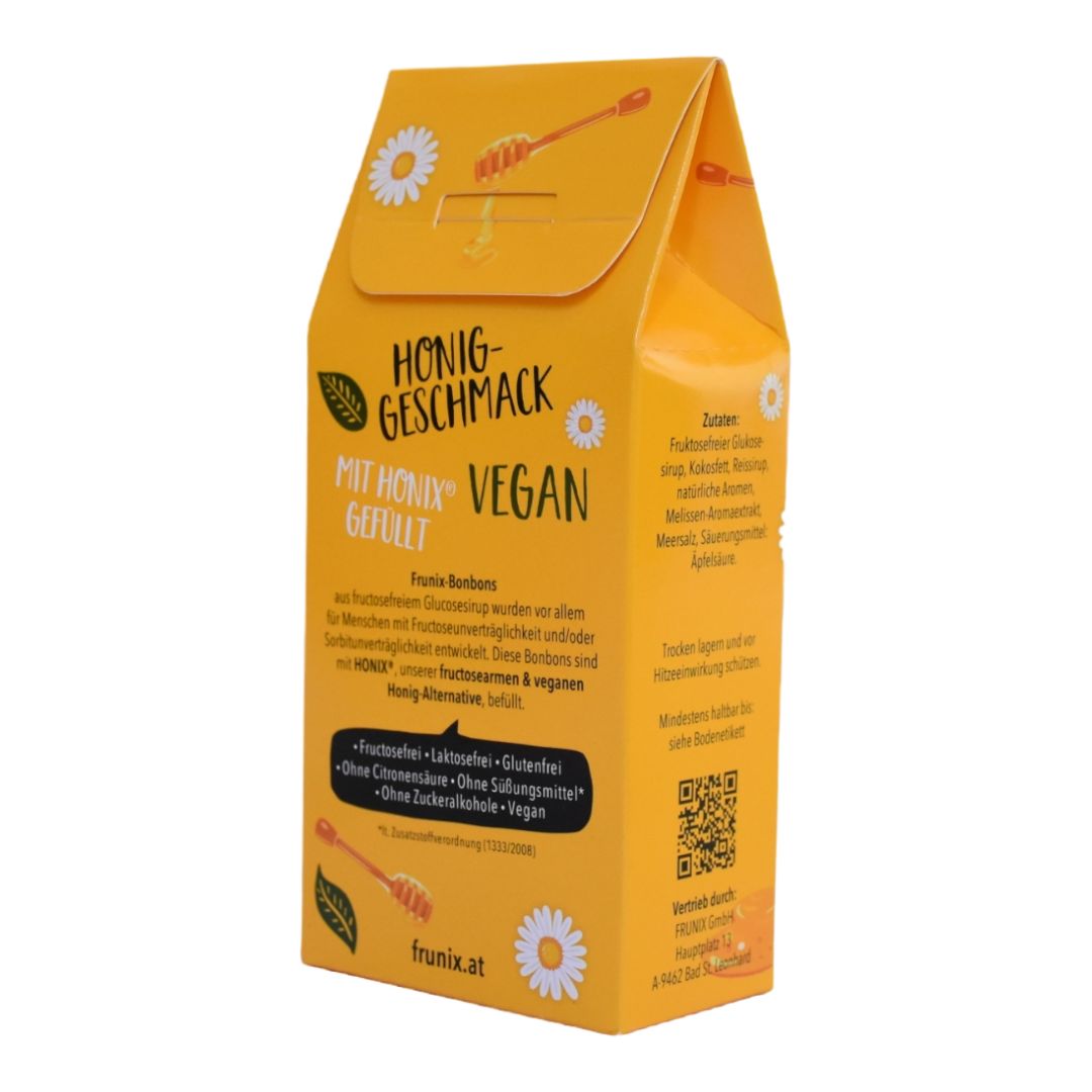 Gelbe Verpackung mit Honig-Geschmack. Aufschrift: MIT HONIX VEGAN GEFÜLLT. Enthält Hinweise zu Inhaltsstoffen.