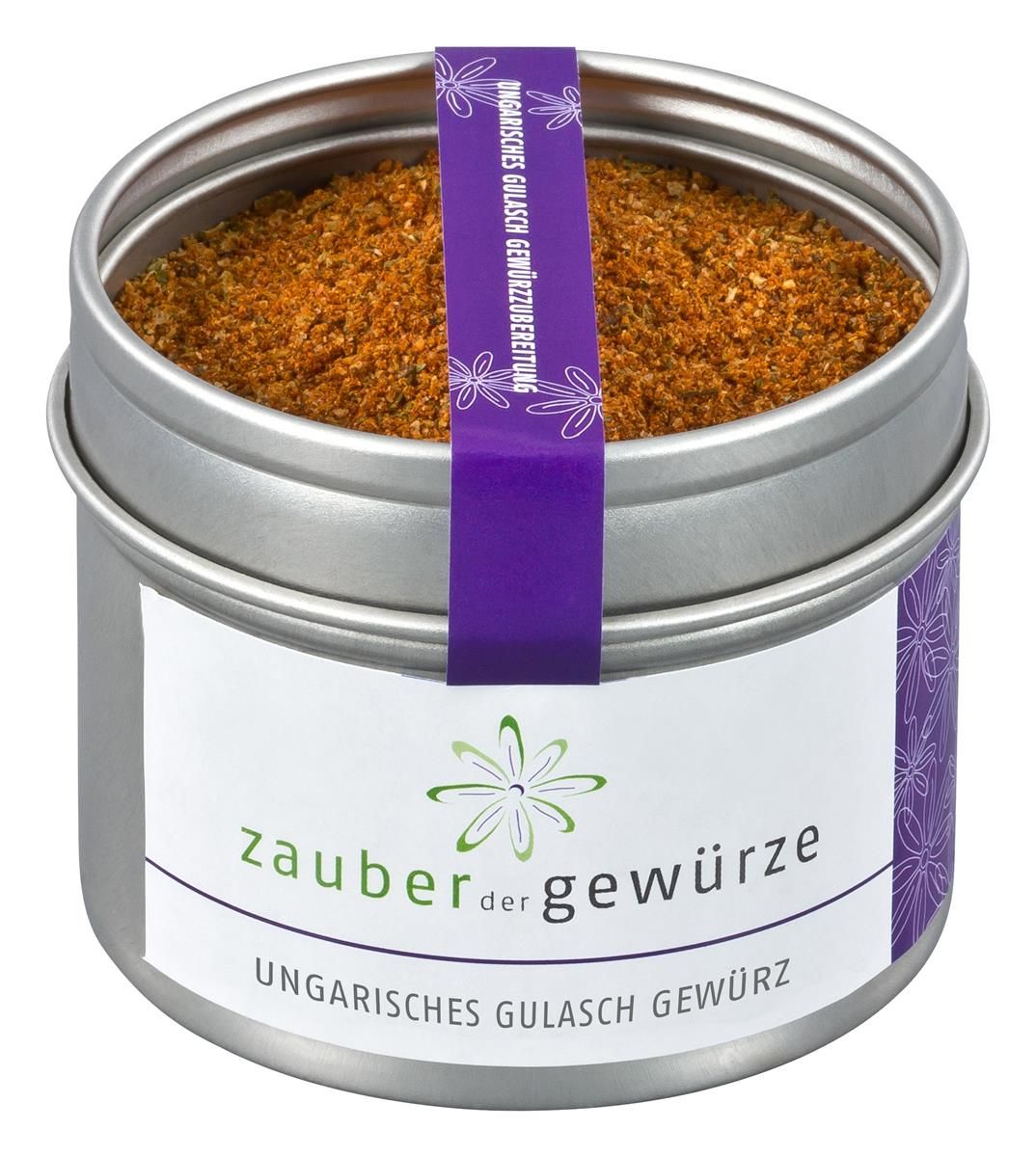 Runde Dose mit Gewürzmischung. Aufkleber mit "Zauber der Gewürze" und "Ungarisches Gulasch Gewürz". Lila Band mit Text.