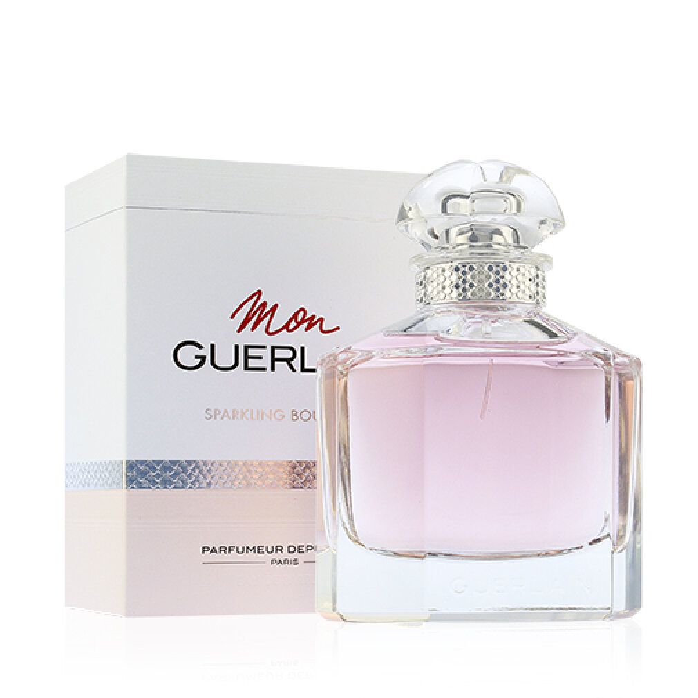 Flakon und Verpackung. Flakon mit rosa Flüssigkeit, silberfarbenem Ring und transparentem Deckel. Verpackung mit Schriftzug "Mon Guerlain".