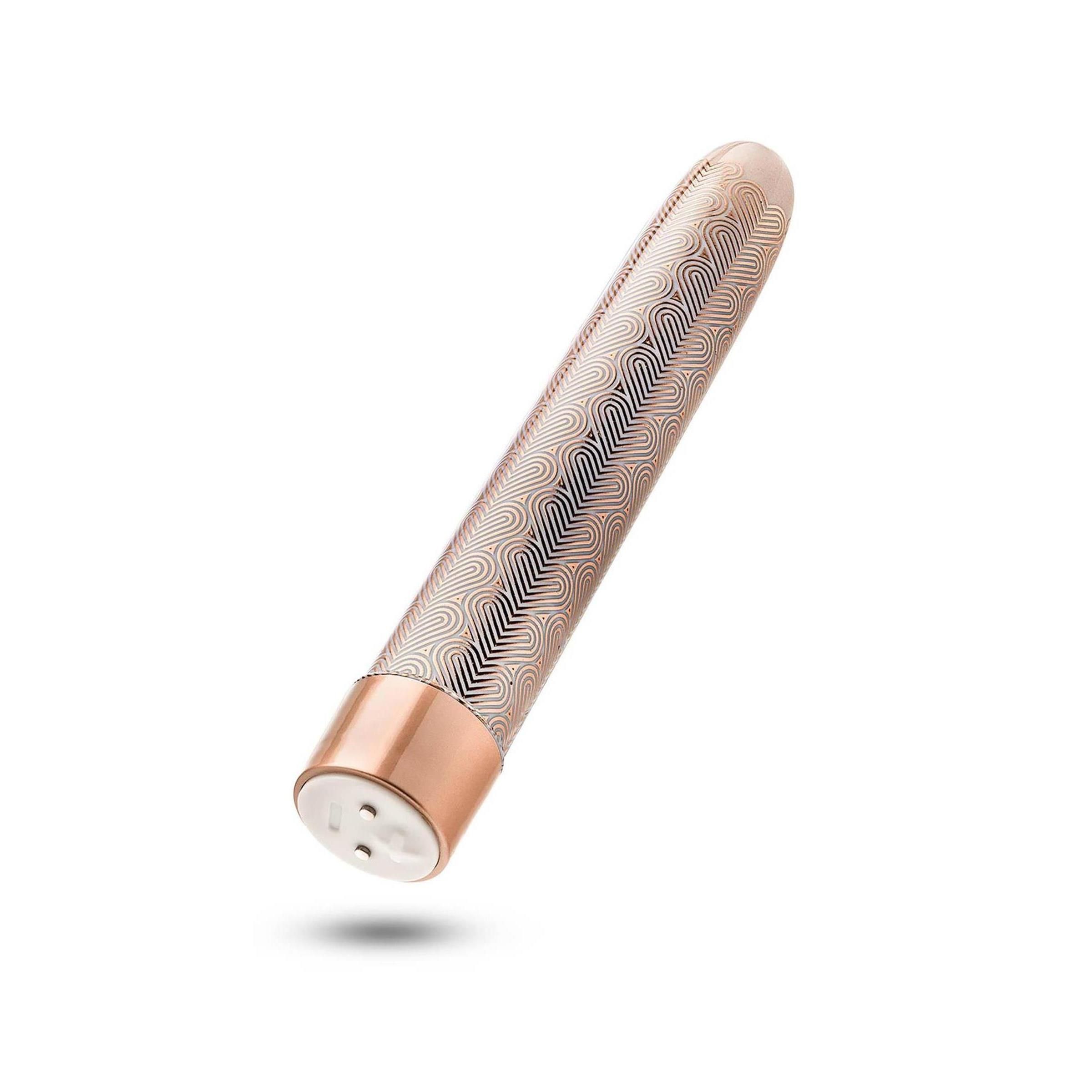 Wellness-Produkt in Roségold mit wellenförmigem Muster. Unterteil und Spitze glatt. Perspektivische Ansicht.