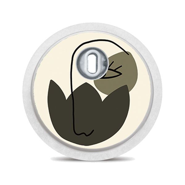 Runder Aufkleber mit abstraktem Gesicht in Beige, Grün und Schwarz. Mit silbernem Mittelteil.