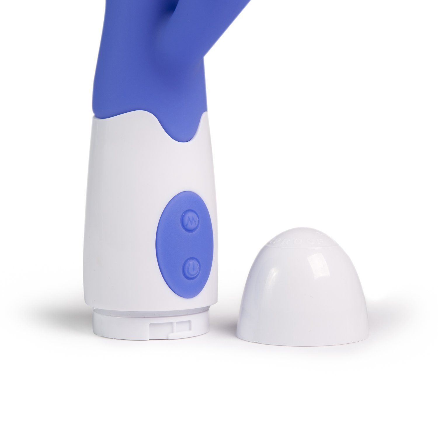Nahaufnahme des weißen Sockels und der lila Spitze eines Penisvibrators. Abnehmbare Kappe.