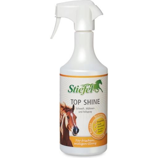 Weiße Sprühflasche mit orangefarbenem Etikett. Aufschrift: Stiefel Top Shine. Abbildung eines Pferdekopfes.