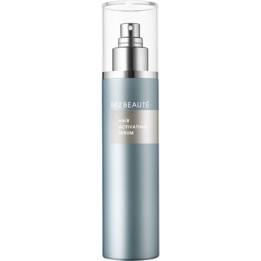 Blauer Pumpspender des M2 BEAUTÉ Hair Activating Serums mit silbernem Applikator und durchsichtigem Deckel, auf weißem Hintergrund.