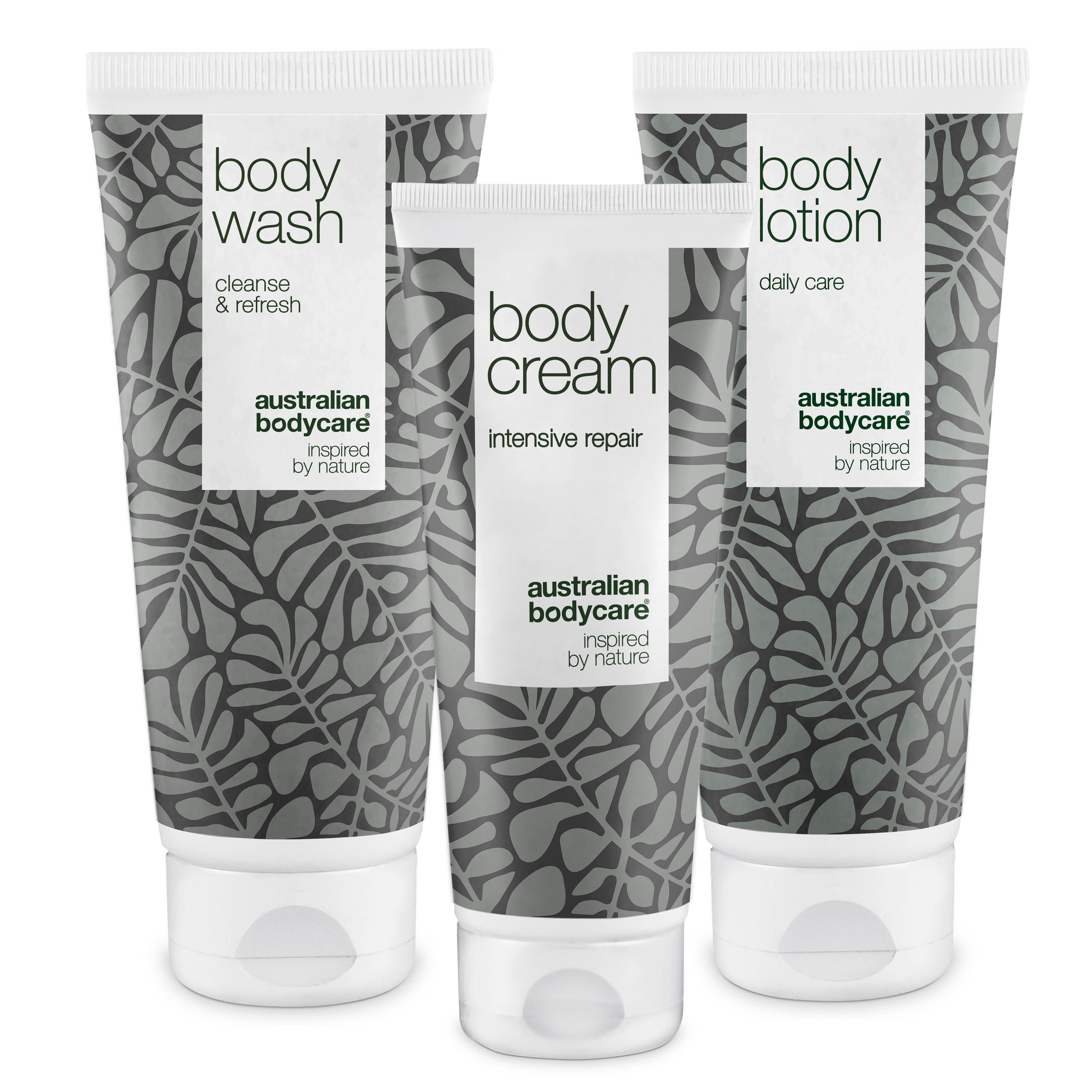 Drei Tuben Australian Bodycare Körperset. Body Wash, Body Cream und Body Lotion. Graues Blattmuster, weißer Deckel.