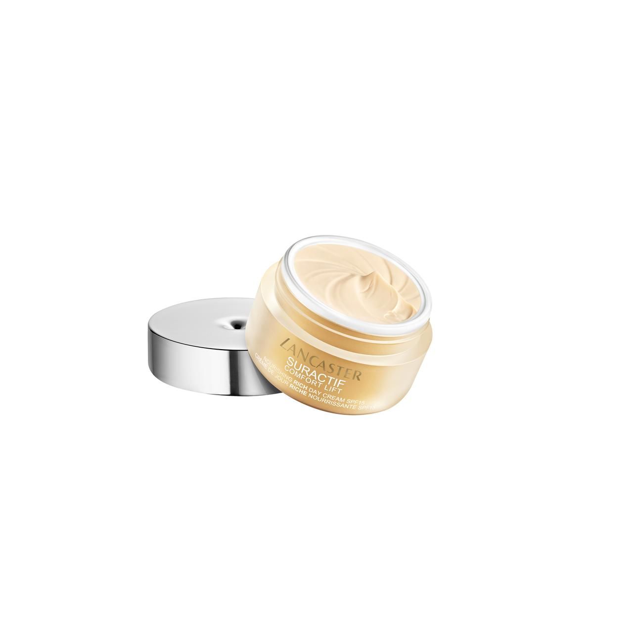 Geöffneter Creme-Tiegel mit silbernem Deckel. Creme sichtbar. Aufschrift: Lancaster, Suractif Comfort Lift.