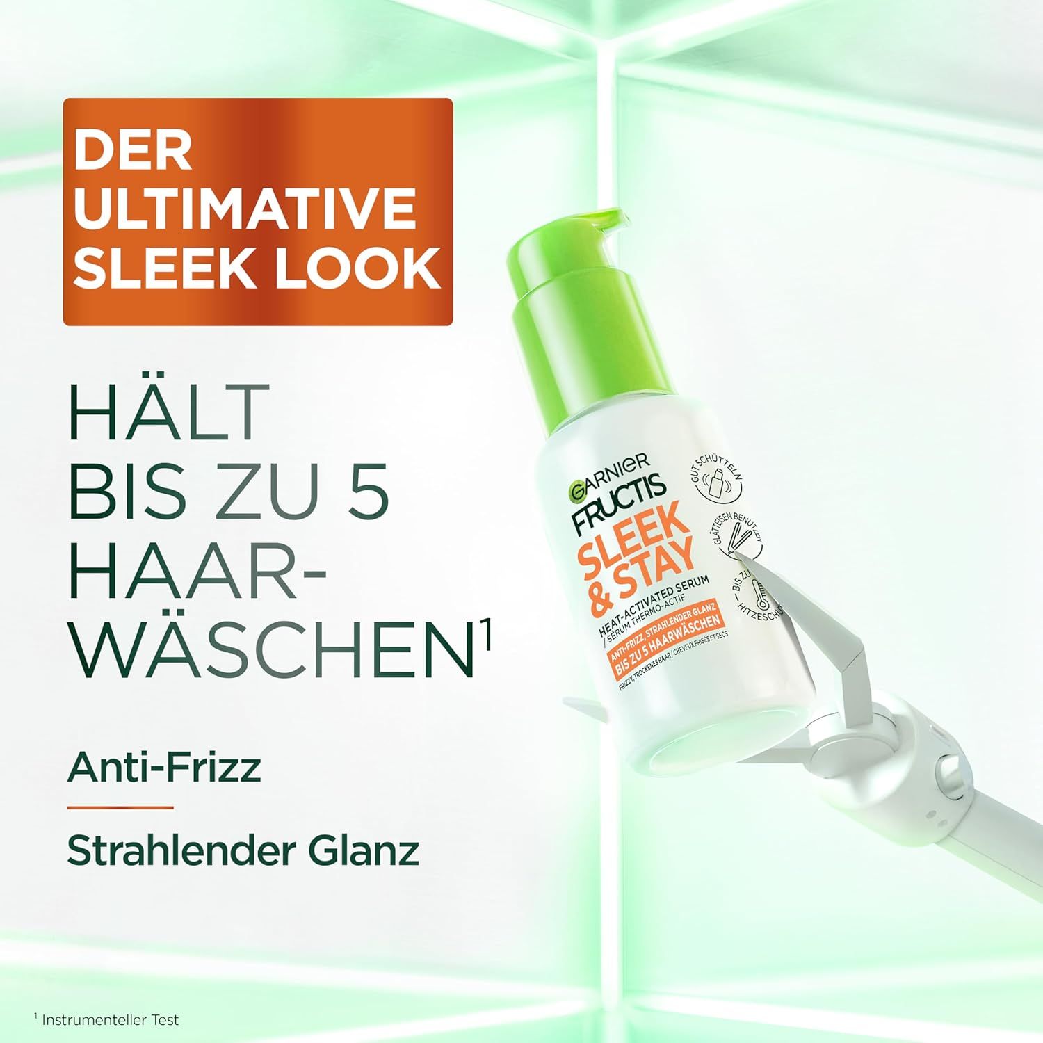 Garnier Fructis Sleek & Stay Heat Serum Flasche, grüne Pumpe, weißes Etikett. Text: Hält bis zu 5 Haarwäschen, Anti-Frizz, strahlender Glanz.