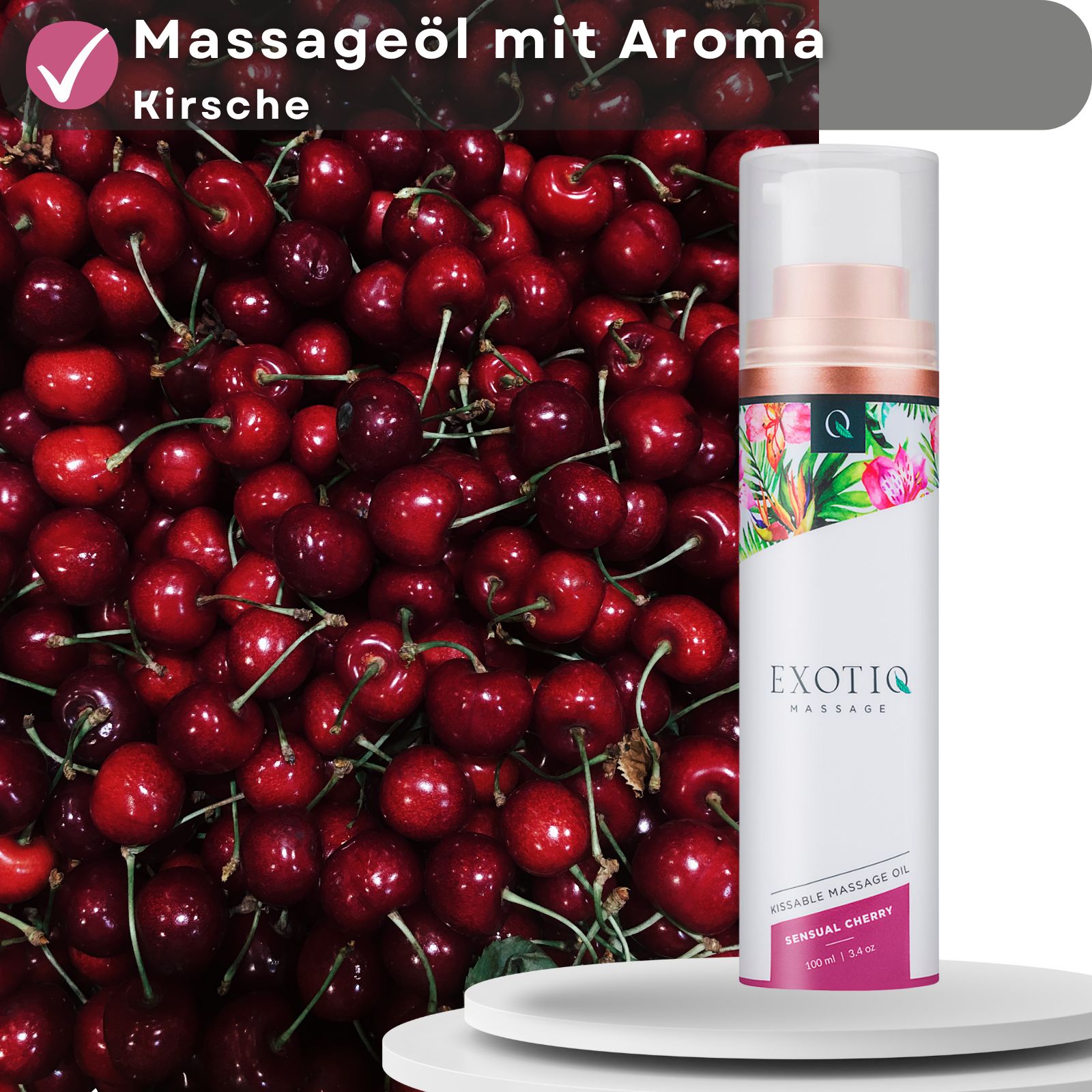 Massageöl mit Aroma Kirsche, neben Kirschen. Produkt mit Logo und floralem Design. Check-Zeichen.