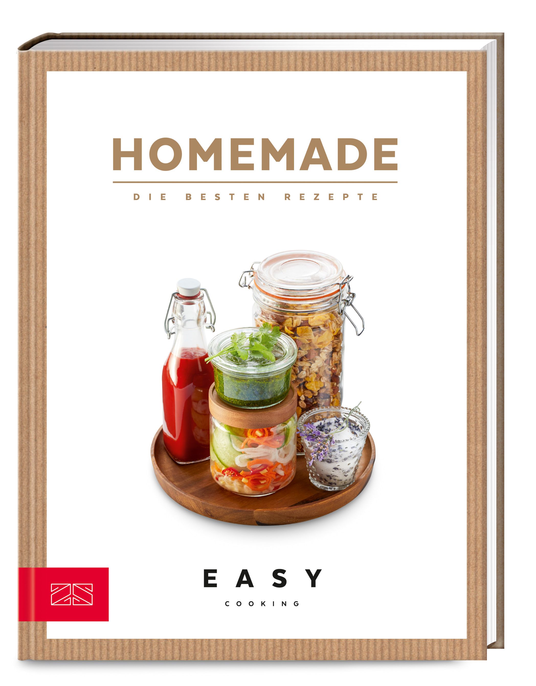 Buchcover mit dem Titel "Homemade". Darunter Gläser mit Lebensmitteln auf einem Holztablett. Unten steht "Easy Cooking".
