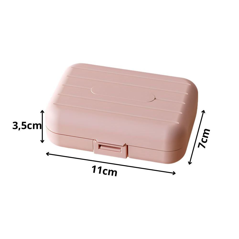 Rosa Tablettenbox mit geriffelter Oberfläche. Maße: 11cm x 7cm x 3,5cm. Rechteckige Form, mit Verschluss.