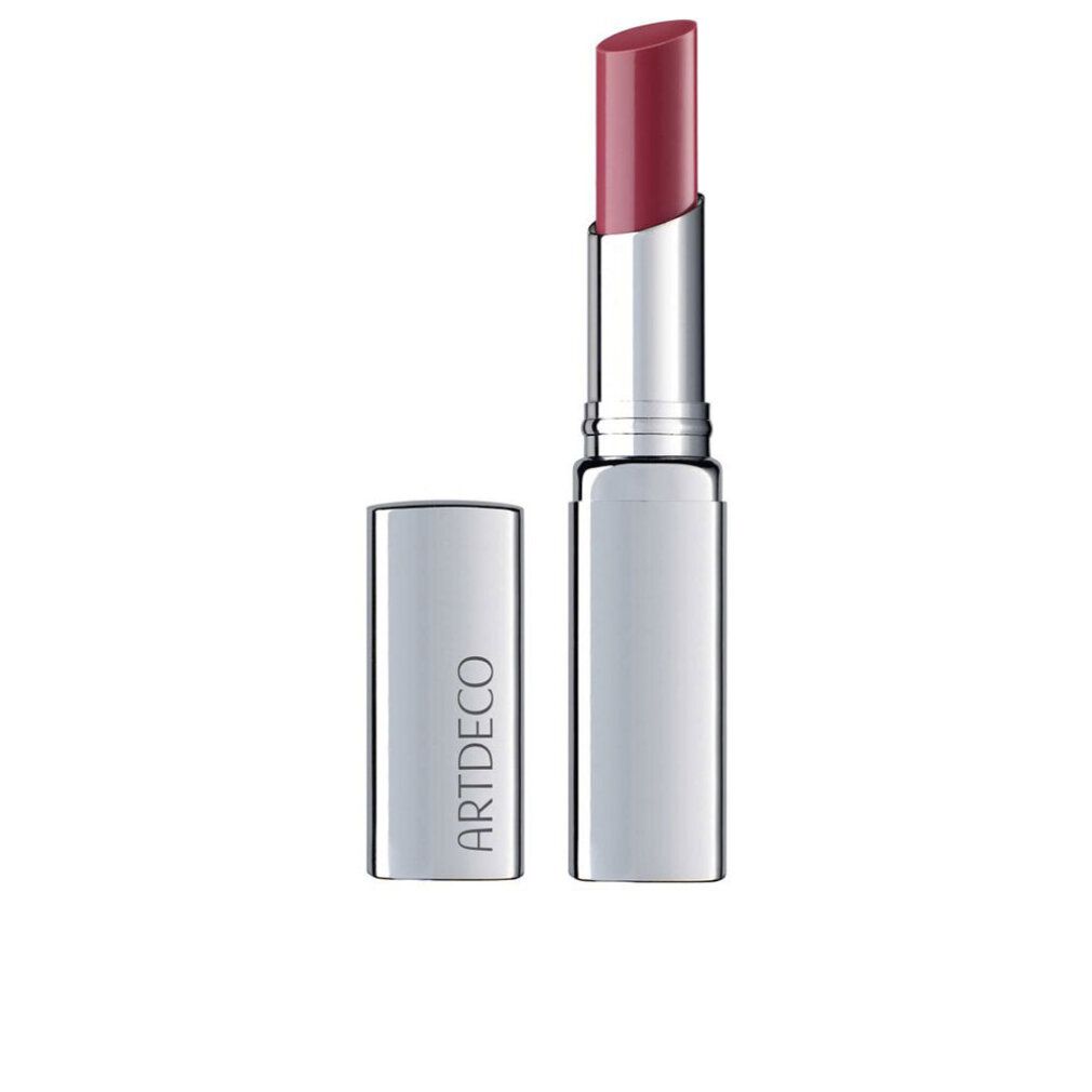 Lippenbalsam in silberner Hülse. Der Lippenstift ist ausgefahren und zeigt eine rote Farbe. Der Deckel liegt daneben. Auf dem Deckel steht "ARTDECO".