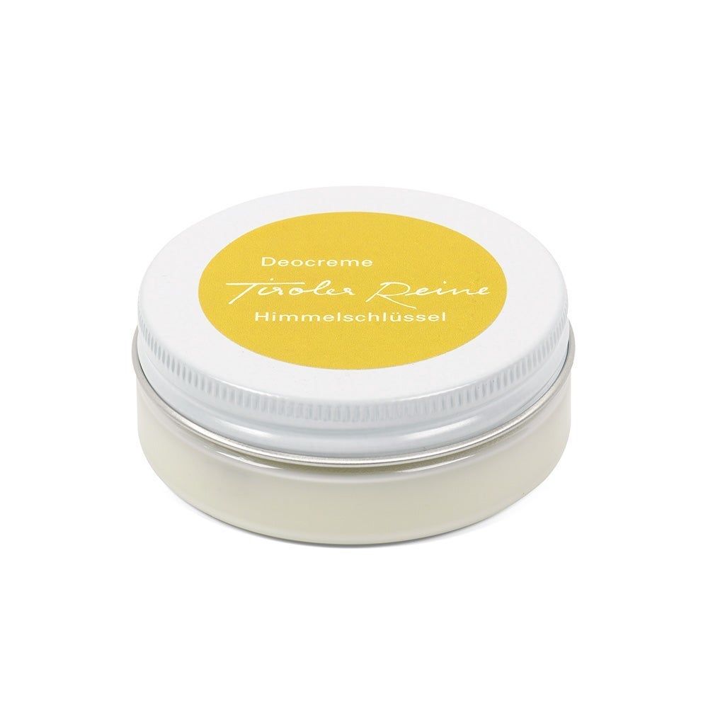 Runde Dose mit weißem Deckel und gelbem Etikett. Aufschrift: Deocreme, Tiroler Reine, Himmelschlüssel.