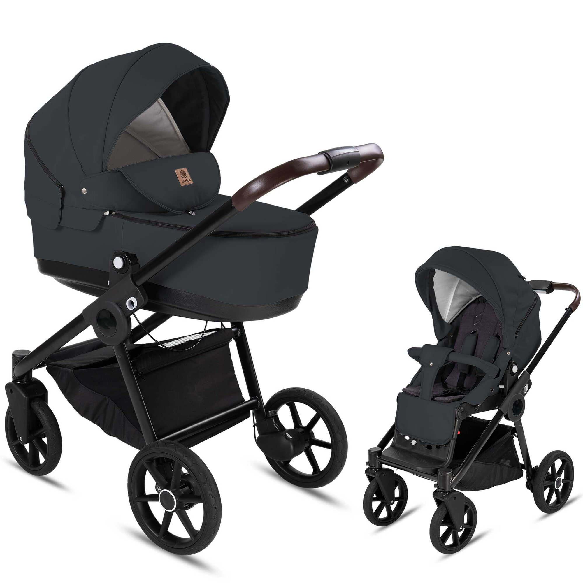 Dunkelgrauer Kombikinderwagen mit Luftreifen. Zwei Konfigurationen: Babywanne und Sportsitz. Schwarzes Gestell, brauner Griff.